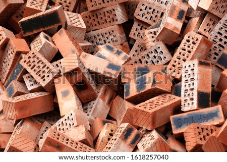 Many red bricks were stacked together