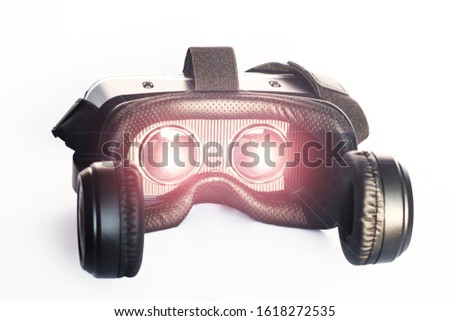 Cropped shot of virtual reality (VR)  glasses with flares on white background. VR gadget concept