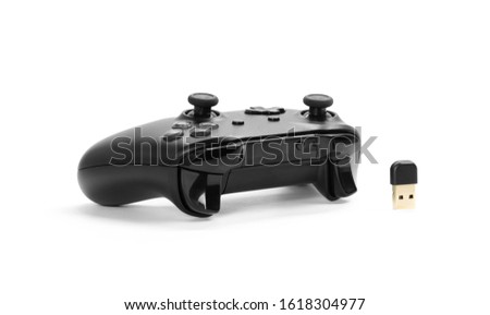 Black gamepad for playing computer games. Gamepad and receiver for PC.