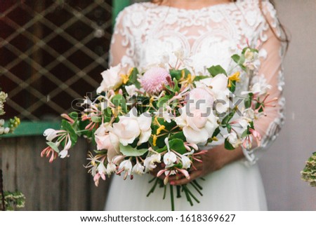 bouquet of flowers in the hands of a young girl