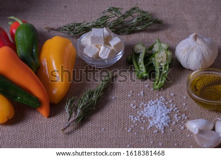 pepper, cheese and spices on sackcloth