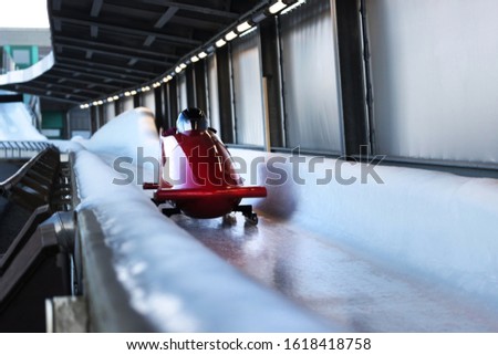 bob sled speeding in an ice channel