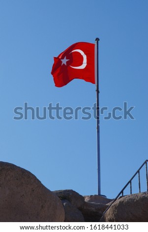 Turkish flag soaring in the wind with the blue sky background