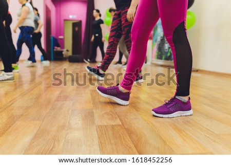 Close up photo of woman's legs. Girl jumping on the skipping rope in gym.