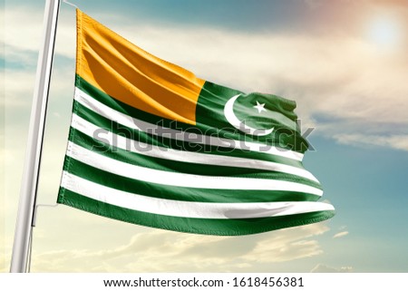 Kashmir national flag cloth fabric waving on the sky with beautiful sun light