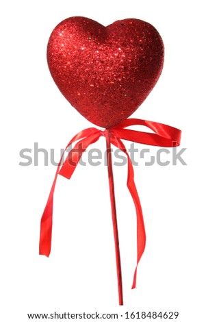 Valentines Day Heart. A red glitter heart on a stick with a red bow. Isolated on white. Room for text. Clipping Path. People world wide celebrate Valentines Day with Hearts and Flowers. Love is here. 