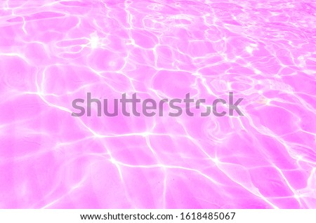 The pink water surface There's a flashing light from the sun.