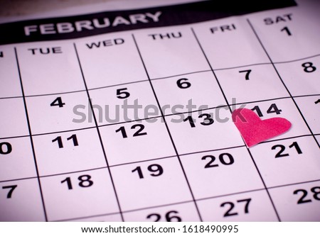 Marked day 14 February calendar sheet with heart