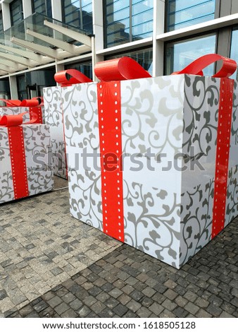 large gift boxes on the background of the building