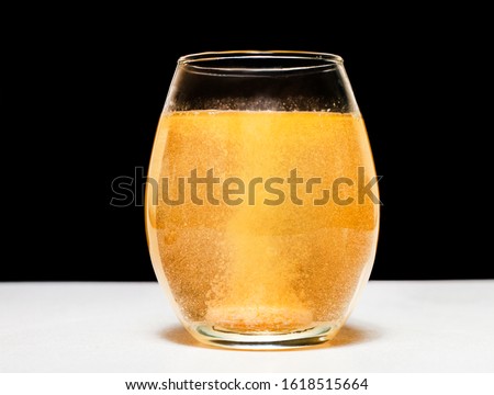 View of a effervescent Tablet dissolving in water.