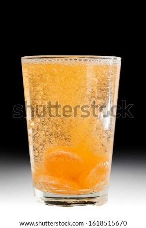 View of a effervescent Tablet dissolving in water.
