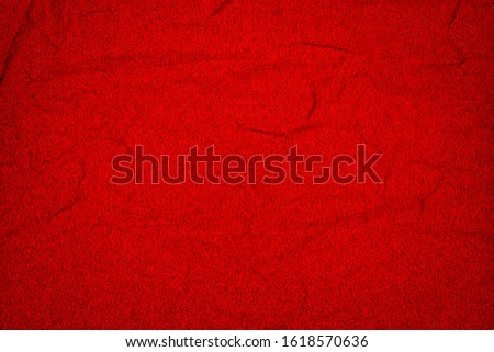 Red crumpled paper texture background, copy space. Red wrapping paper as Christmas background or for Chinese New year Card or Valentines day 