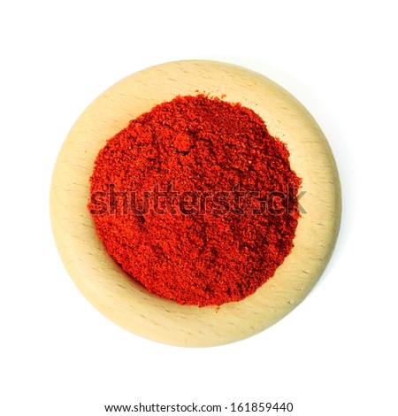 Wooden ring with red ground pepper on white background
