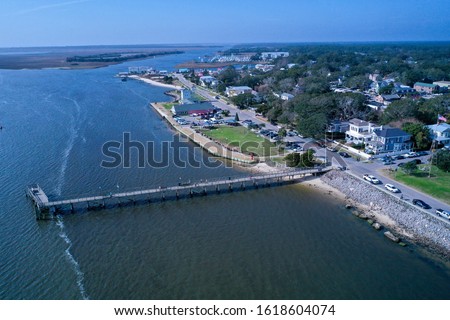 Aerial view of the town of Southport NC pier. Looking over the cape fear river at the city water front. Royalty-Free Stock Photo #1618604074