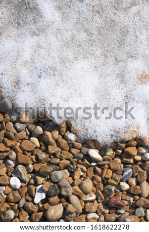 High-angle view of pebbles on the beach