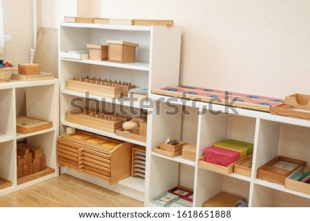 Montessori wood material for the learning of children. Shelving in a Montessori class. Royalty-Free Stock Photo #1618651888