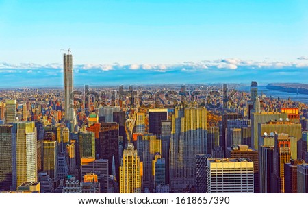 Aerial panoramic view to Midtown Manhattan and Central Park NYC, USA. Skyline with skyscrapers at sunset. New York city. American architecture building. Panorama of Metropolis. Cityscape. Mixed media.