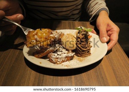 French toast and ice cream on white plate