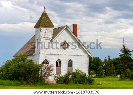 Old abandoned weathered rustic United church in the Trossachs, Saskatchewan, Canada.Trossachs is a hamlet in the Canadian province of Saskatchewan.  Royalty-Free Stock Photo #1618703596