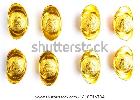 A picture of "yuanbao" or sycee on isolated white background  for Chinese New Year concept. Chinese word written on the gold is prosperity. It is prosperity symbol of wealth and prosperity.