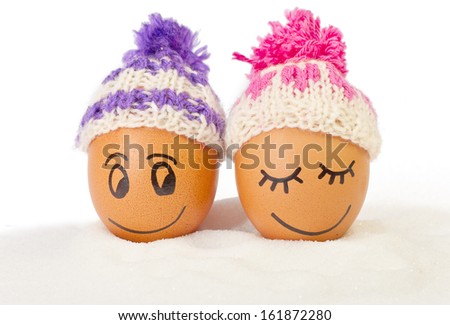 funny lovely eggs in winter hats and sugar like a snow. together is more warmer .