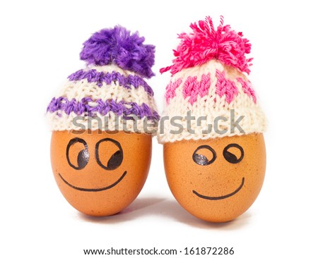 funny lovely eggs in winter hats. together is more warmer .