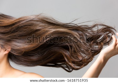 Lively hair on a gray background. Royalty-Free Stock Photo #1618751935
