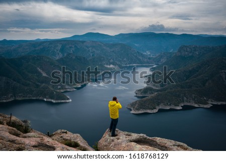 
An incredible river with a climber taking pictures