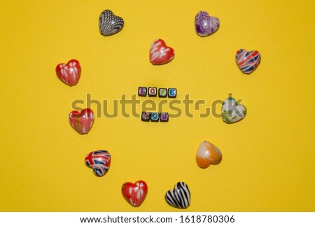 little hearts flatly. little hearts flatly the inscription love you on a yellow background. Valentine's Day. Romantic background for Wedding, Valentines day.