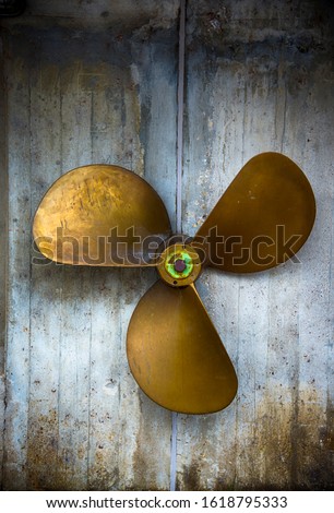 Old ship propeller, vintage background Royalty-Free Stock Photo #1618795333