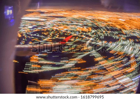 the swirling world on the plane, long exposure picture taken from inside the window of an airplane flying