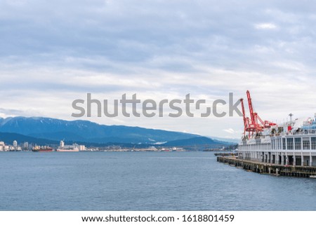 View on Vancouver Downtown and Mountains over ocean. British Columbia. Canada.
