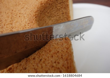Cut chiffon cake with bread knife.
