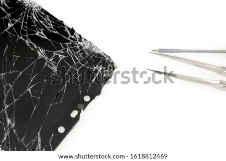Broken screen for preparing, repairing or replacing a new screen on a white background.