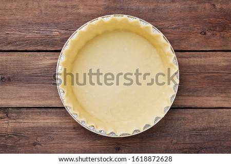 Homemade  pie preparation, empty pie  crust. top view Royalty-Free Stock Photo #1618872628