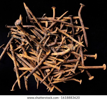 pile of rusty iron nails