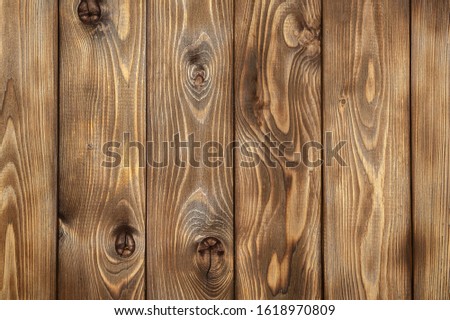 Burnt brown wood planks close-up for background, wood texture
