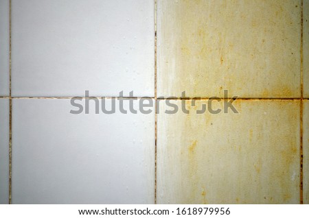 Before and after cleaning dirt on floors, walls, and corners of bathroom tiles It is slippery and potentially dangerous. accumulation of pathogens. Dirty. Royalty-Free Stock Photo #1618979956