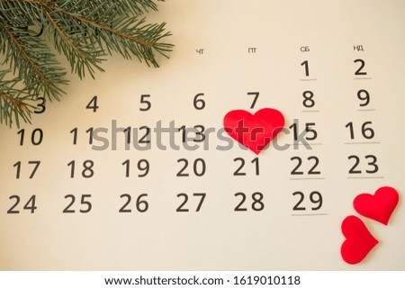 red hearts on the calendar February 14th.Christmas tree layout and wormwood drill.top view