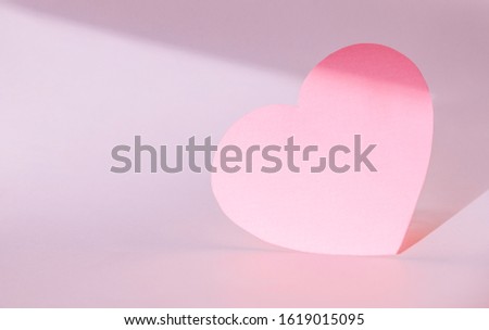 Paper heart on lavender color background. Copy space