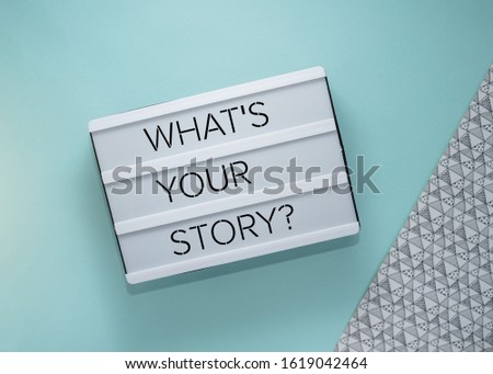 What's your story? Text on lightbox on blue background
