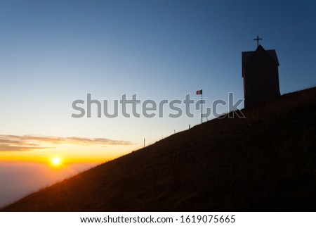 Dawn at the little church, mount Grappa landscape, Italy. Italian alps panorama