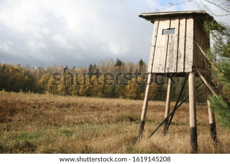 old booth stands alone in the field