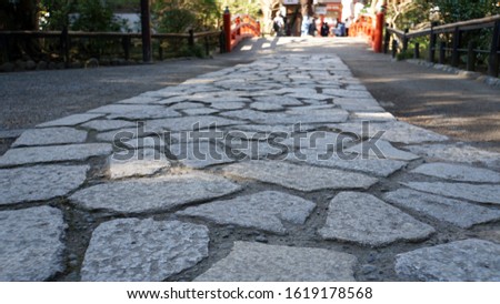 A cobbled road in the precincts of a shrine in Japan                            