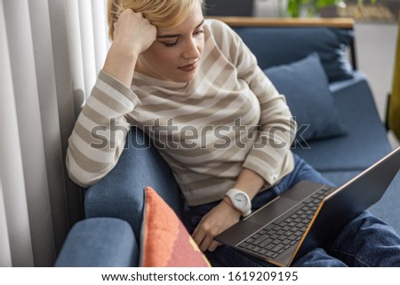 Cropped photo of attractive lady working at home while using gadget stock photo