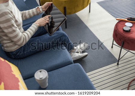 Cropped photo of lady working with tablet at home stock photo