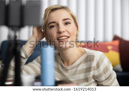 Cropped photo of happy lady making video content at home stock photo
