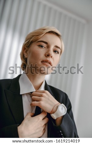 Cropped photo of attractive lady wearing black suit stock photo
