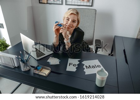 Top view of happy pretty lady resting while sitting at desktop stock photo