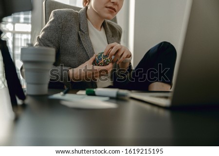 Cropped photo of attractive lady looking at screen while working stock photo